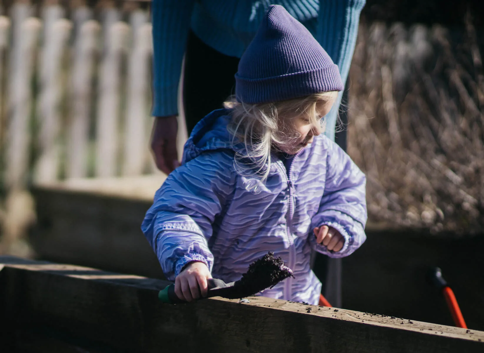 Child Playing in Mud Kitchen
