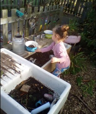 Child Gardening in Mud Kitchen