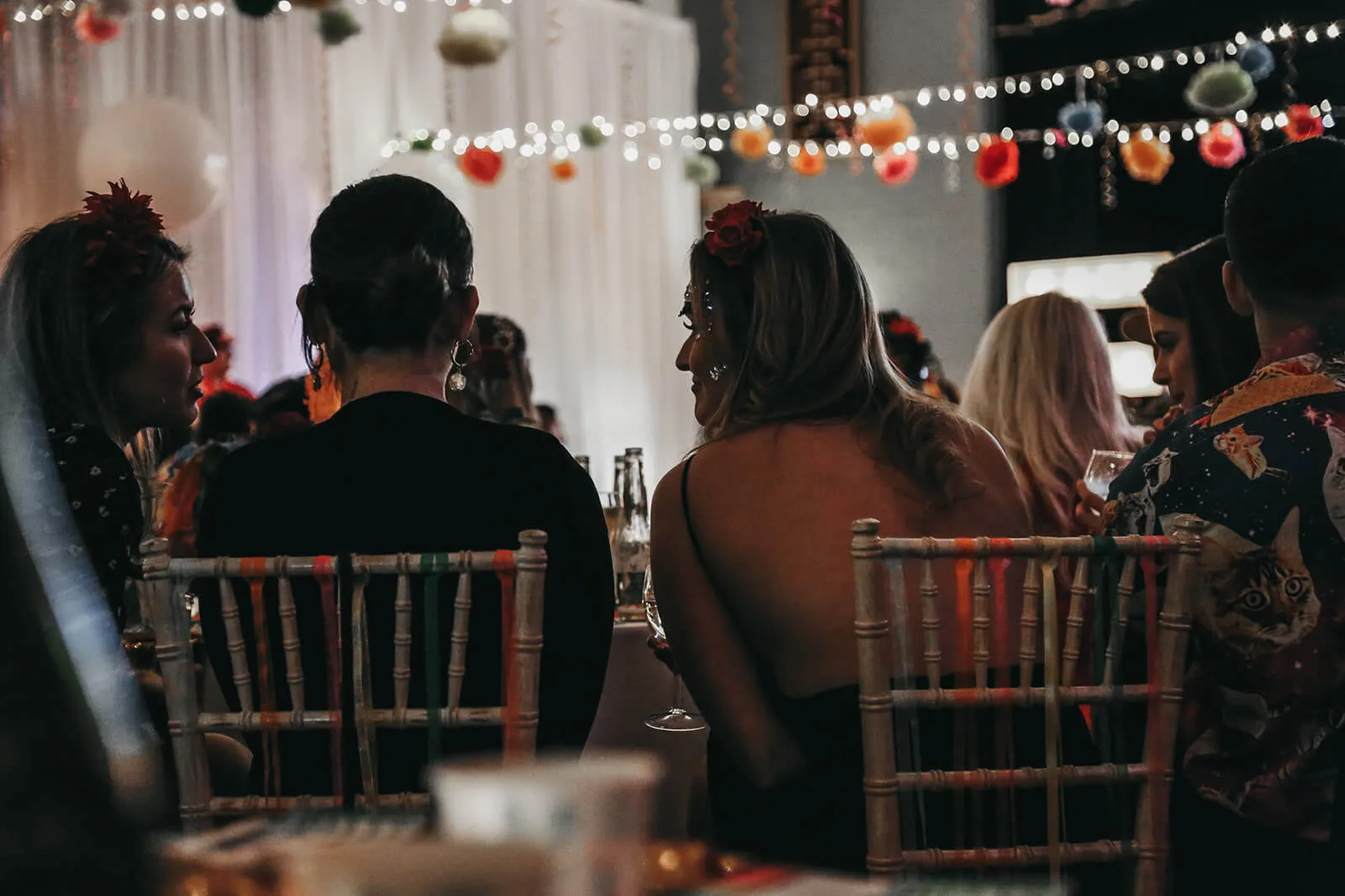 People Sat Enjoying Party