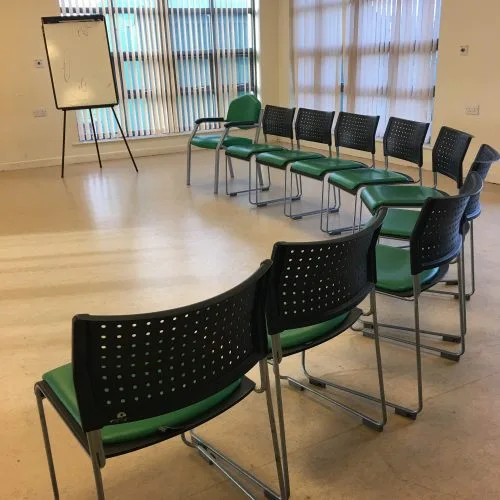 Semi-Circle of Chairs Set Up For Meeting